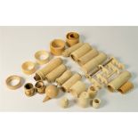 A large collection of ivory and bone pieces to include, thread holders, counter holders, napkin