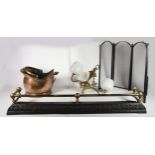 A cast metal & brass fire curb, together with a copper coal helmet, a three fold fire screen, irons,