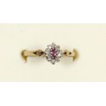 A 9ct gold ruby and diamond cluster ring, K, 1.8gm