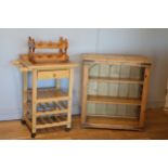 A stained pine free stading book case, with three open shelves, with metal work decoration, 85cm x