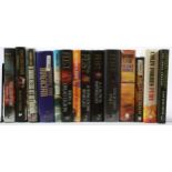 A A collection of seventy five hardback first edition novels,consisting of high fantasy and military