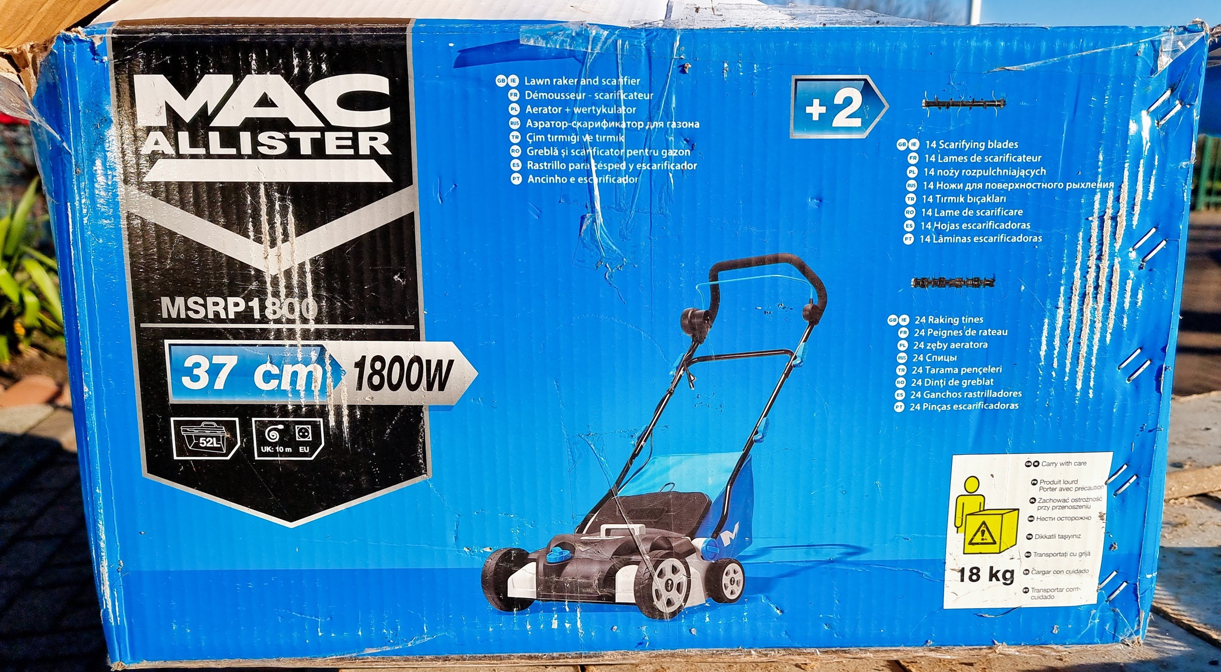 A MacAllister MSRP 1800 37cm 1800W lawn raker and scarifier, apparently unused, boxed