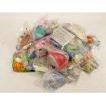 A collection of 200 McDonalds Happy Meal toy sets, bagged, 1980 through 1990, to include