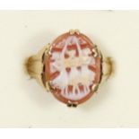 A 9ct gold a shell cameo ring, depicting the three graces, O, 2.7gm