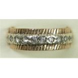 A 9ct yellow and white gold and white stone eternity ring, Q, 4gm