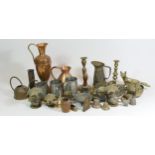 A collection of brass & copper wares, to include coal helmets, kettles, measuring jugs,