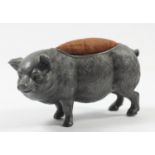 A novelty pewter pin cushion, in the form of a hairy pig, 14cm, crack to front leg