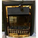 A Dimplex electric fire/heater, 'real flame effect' imitating a coal fire, with cast brass grate &