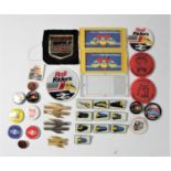 A collection of railway pin badges, patches and three hand held metal ball games