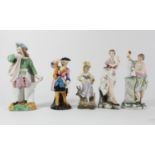 Five 19th century continental porcelain figurines depicting characters performing, marked to bases