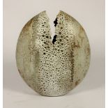 Alan Wallwork (1931- 2019); a stoneware split pebble with impressed decoration around the parting,