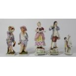 Five continental porcelain figurines to include, a male and female performing, two children and a