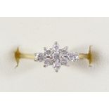 An 18ct gold and diamond cluster ring, claw set with brilliant cut stones, J, 2.1gm