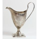 A George III Provincial silver helmet shape cream jug, by Thomas Law, Sheffield 1799, with bright