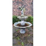 A two tier cast stone effect water fountain, by Hand Studio c.1979, the child holding a dove