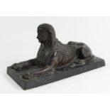 A 19th century French bronze statue of a sphinx, mounted on a black marble base, 26 x 11 x 13cm