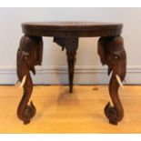 An Anglo Indian rosewood side table, finely hand carved top with three carved elephant heads forming