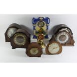 A Victorian Postman's alarm clock with painted 18cm dial, together with a porcelain parlor clock,