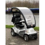 A T.G.A Breezes 4 wheeled mobility scooter complete with rear luggage box and detachable solid