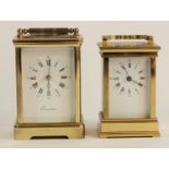 A French brass cased manual wind carriage clock, beveled edge glass panels, open jeweled escapement,