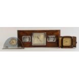 A 1920's Art Deco travel alarm clock, Swiss made, complete with original case, together with a