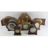 A collection of mid 20th Century mantle clocks to include makers - Elliott, Smiths, Masons, and