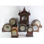 A collection of early 20th Century and later mantle clocks, to include Edwardian inlaid 8 day,