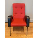 A Jules Leleu style French mid 20th Century armchair, upholstered in red and black faux leather with