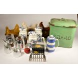 A mid 20th Century white enamelware flour bin, together with a green enamel bread bin, various sized