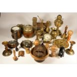 A collection of brass & copper wares, to include candlesticks, chargers, an oil lamp, chamber