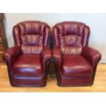 A Burgundy leather three piece suite, comprising of a 3 s seater sofa and a pair of matching