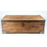 A rustic pine plank traveling trunk, with hinged lid, steel bound corners and edging, cast drop