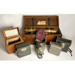 Four examples of Vintage Technology, including a Grey & Selby of Nottingham Theodolite, cases, a