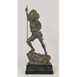 A mid 20th century spelter Scouts trophy / figurine of a young boy scout reaching the peak of a