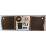 A AKAI Model 1720W Four Track Stereophonic Solid State reel to reel player, two CM-15 microphones,