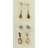 A 9ct gold and citrine pair of ear rings, a 9ct gold tigers eye pair and a 9ct gold emerald pair,