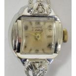 Olympic, a 14K white gold and diamond ladies cocktail wristwatch