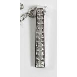 A 9ct white gold and diamond line pendant, chain, 1.6gm