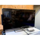 A Panasonic (model TX-55CS520B) 55inch TV, remote, AV and power cables, together with a Q
