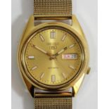 Seiko 5, a gold plated steel automatic day/date gentleman's wristwatch, 7S26-0480, visible movement,