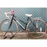 A Peugeot Monaco ladies bicycle, 27inch wheels, mud guards, pump, horn and bell, together with a