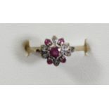 A 9ct gold ruby and diamond cluster ring, L 1/2, 1.3gm