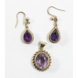 A 9ct gold and amethyst pendant, stone 12 x 10mm and a pair of 9ct gold amethyst pear shape ear
