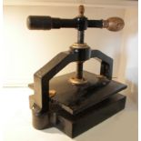 A Victorian cast iron & brass book binding press, painted black and gold, 12"x10" nipping surface.