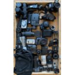 A collection of cameras, both film and digital, along with lens, photography and camera accessories,