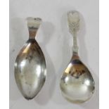 A George III silver caddy spoon, by WP, Birmingham 1781 and a silver bright cut caddy spoon,