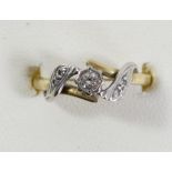 An 18ct gold single brilliant cut diamond ring, diamond set shoulders, L, 2.9gm