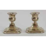 A silver pair of desk candlesticks, Chester 1933, 7.5cm, filled.