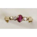 A 9ct gold ruby and diamond three stone ring, S, 3.1gm