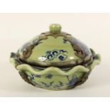 A Chinese blue and green glaze lidded bowl, with boys and a kite pattern to the bowl, dragon to